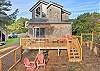 Back deck and outdoor patio with outside dining table and chairs