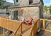 Back deck and outdoor patio with outside dining table and chairs