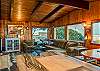 Living space with TV and wood stove. Ocean and mountain views