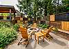 Fenced back yard garden with firepit, hot tub, sauna, covered outdoor dining area