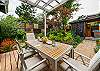 Fenced back yard garden with firepit, hot tub, sauna, covered outdoor dining area