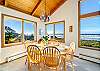 Dining room with seating for 6, ocean views and mountain views.