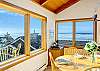 Dining room with seating for 6, ocean views and mountain views.