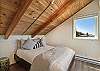 Third floor bedroom with ocean views and queen bed.