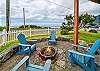 Outdoor firepit and New hot tub, with fenced in hard, and upper deck has wind protected deck with fire table and out door seating