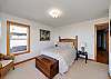 Downstairs queen bed with Ocean view.