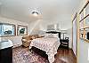 Upstairs Queen bedroom with cozy couch. 