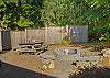 Backyard with Firepit and picnic table. 