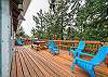 Back deck with picnic table. Perfect for puzzles, dominos etc. Adirondack chairs for lounging and gas BBQ for outdoor grilling. 