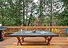 Back deck with picnic table. Perfect for puzzles, dominos etc. Adirondack chairs for lounging and gas BBQ for outdoor grilling. 