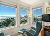 Oceanview living room with woodstove, streaming tv w/ basic channels, reading nook, electric piano. Access to deck with ocean view .