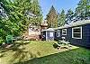 Back yard with picnic table, firepit, and Gas BBQ. 