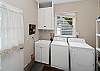 Laundry room with washer/dryer, access to back yard