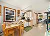 Downstairs small game/dining table in the kitchenette area (no appliances) with sink and gumball machine. 