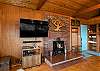 Living room with Cable TV, Electric fireplace, and Ocean views