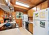 Fully equipped kitchen and stackable washer and dryer