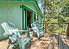 Upper private deck off of loft room with desk and futon. 