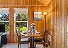 Living room with woodstove, streaming TV, DVD player. 