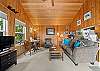 Living room with woodstove, streaming TV, DVD player. 