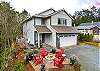 Street view with outdoor firepit. 1 block to the beach and 1/2 block to the golf course