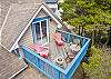  Ocean view deck of master bedroom, outdoor fire table, and bistro table and chairs. 