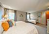 Main floor bedroom with Craftmatic adjustable King bed and twin daybed