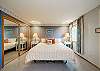 Main floor bedroom with Craftmatic adjustable King bed and twin daybed