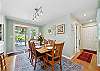 Fully equipped kitchen, and dining area. Door out to the back yard area. 