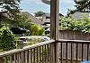 Front covered porch with Adirondack chairs for relaxing in. 