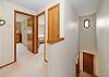 Upstairs hallway with entrance to upstairs bedrooms. 