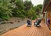 Back yard deck with outdoor dining table, Gas BBQ, lounging chairs. 