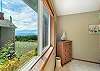 Upstairs queen bed with peak ocean view