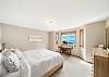 Upstairs King bedroom with ocean view and workspace desk. 