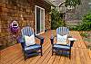 Back yard deck with outdoor dining table, Gas BBQ, lounging chairs. 