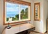 Upstairs King bedroom with ocean view and workspace desk. 