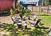 Backyard with firepit area and private hot tub. 