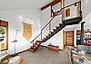 Stairs to upper level with 2 bedrooms, den room and full bath with walk in shower 