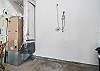 Garage with outdoor shower, bikes, golf clubs (use at your own risk. Bikes not maintained by STS.)