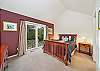 Master bedroom with queen bed, sliding door to back yard, private bath with jacuzzi tub, walk in shower, large walk in closet and double sinks. 