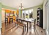 Dining room open to the fully equipped kitchen