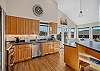 Gourmet kitchen with breakfast bar and ocean view