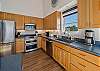 Gourmet kitchen with breakfast bar and ocean view