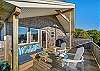 Deck with outdoor lounging furniture and ocean view