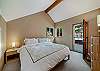 Upstairs King bedroom with access to back deck and hot tub