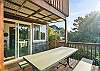 Gas BBQ and picnic table with access to back yard. 