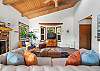 Cozy living room with Streaming TV, open to the dining area. Woodstove is NOT operational. 