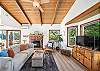 Comfy living room and streaming TV, with access to outside deck and open to the living room. Woodstove is NOT operational