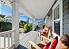 Covered front deck with seating and ocean view