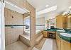 Jacuzzi tub in the master bath with the walk in shower. 