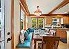 Bench seating for the dining table area that is open to the fully equipped kitchen. 